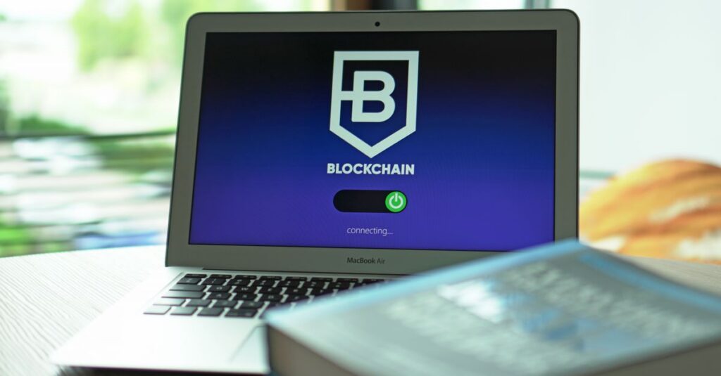 AI DeFi: Laptop with blockchain application interface connecting. Ideal for tech and crypto themes